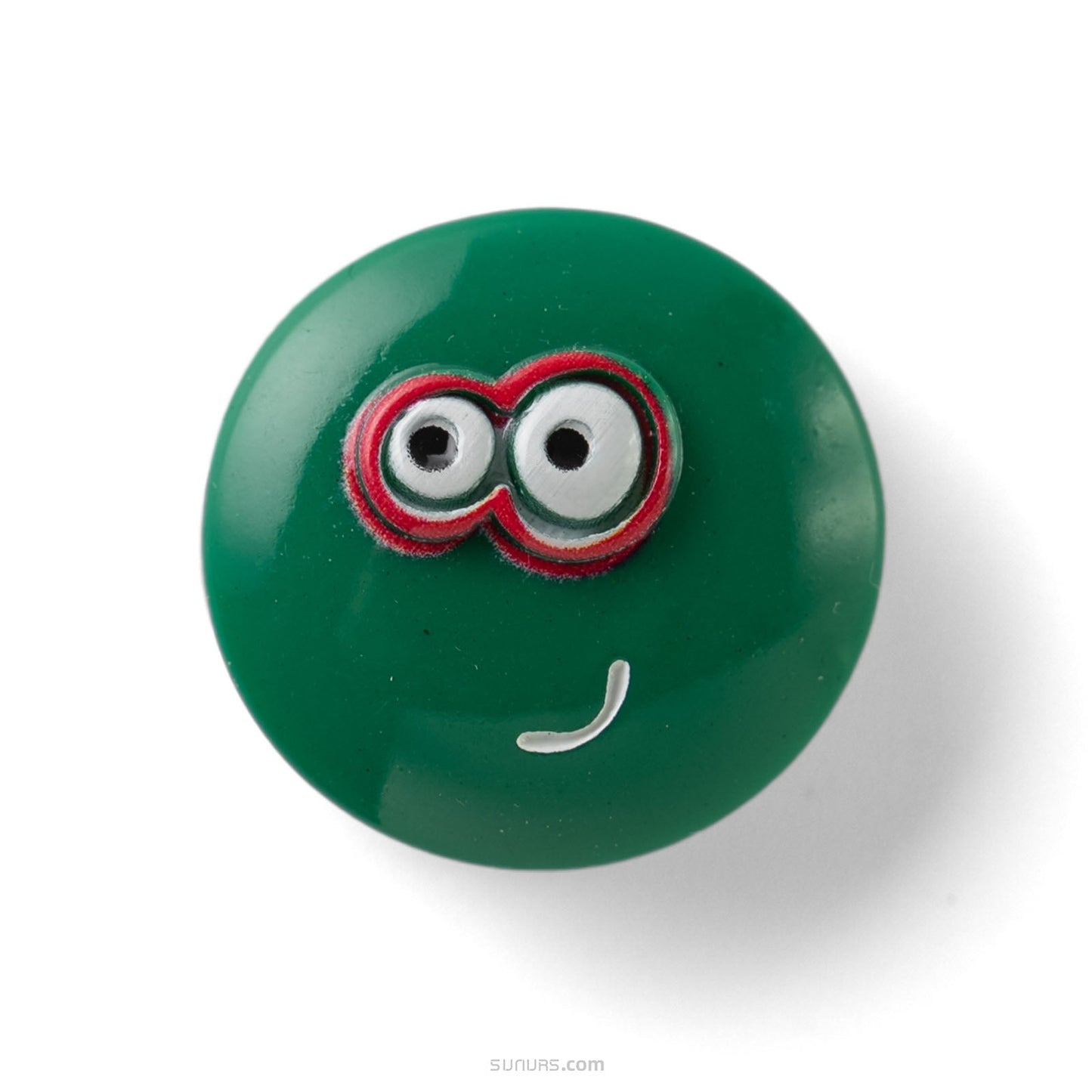 Green round object with cartoonish face on a white background
