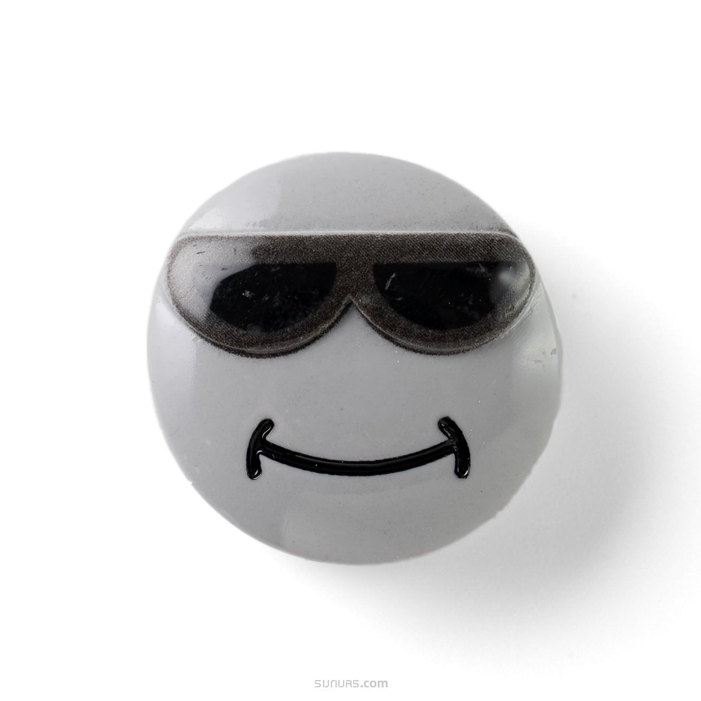 Round gray object with sunglasses and a smiley face on a white background