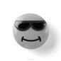Round gray object with sunglasses and a smiley face on a white background