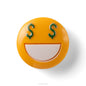 Round yellow object with green dollar signs for eyes on a white background