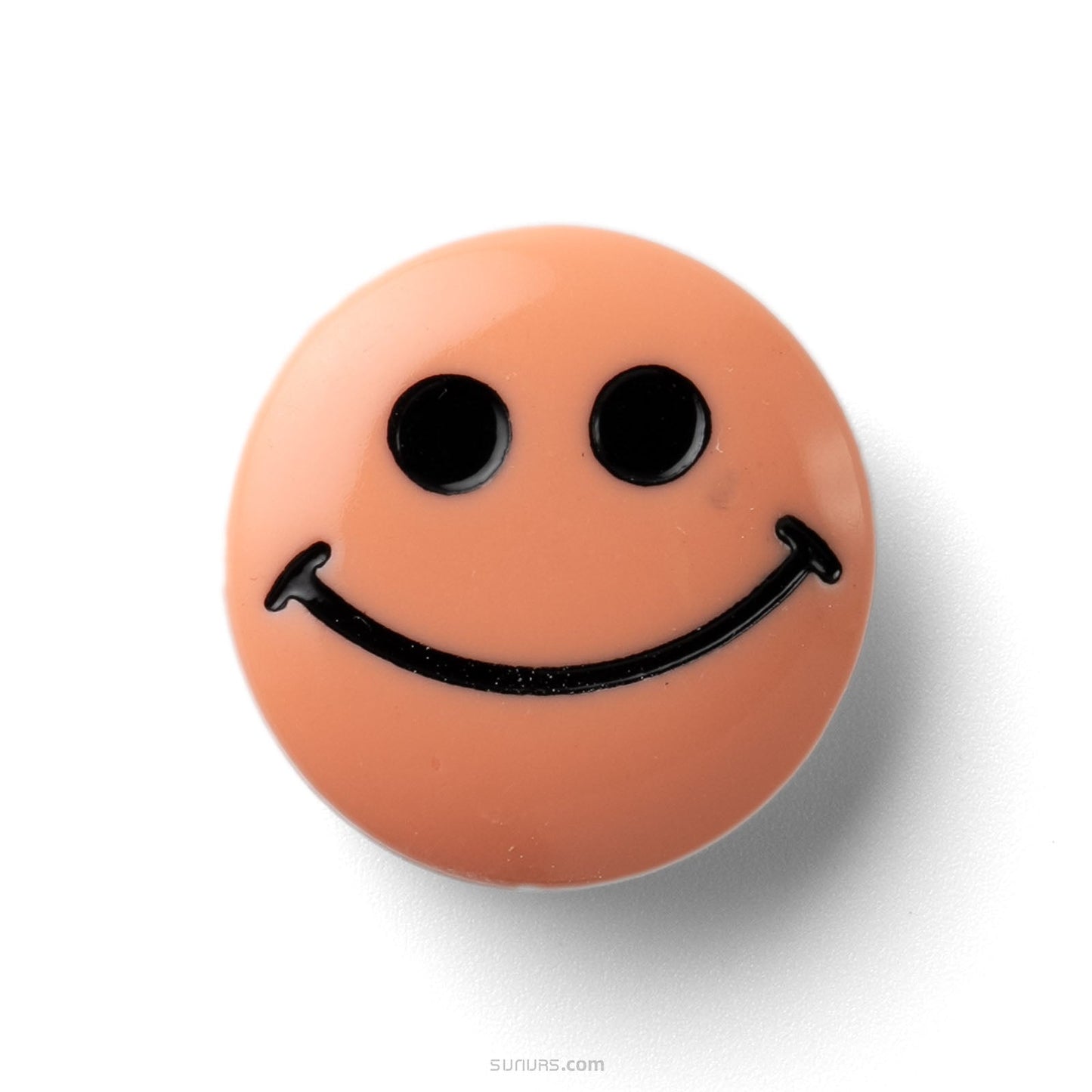 Smiley face drawn on a brown ball with black lines against a white background