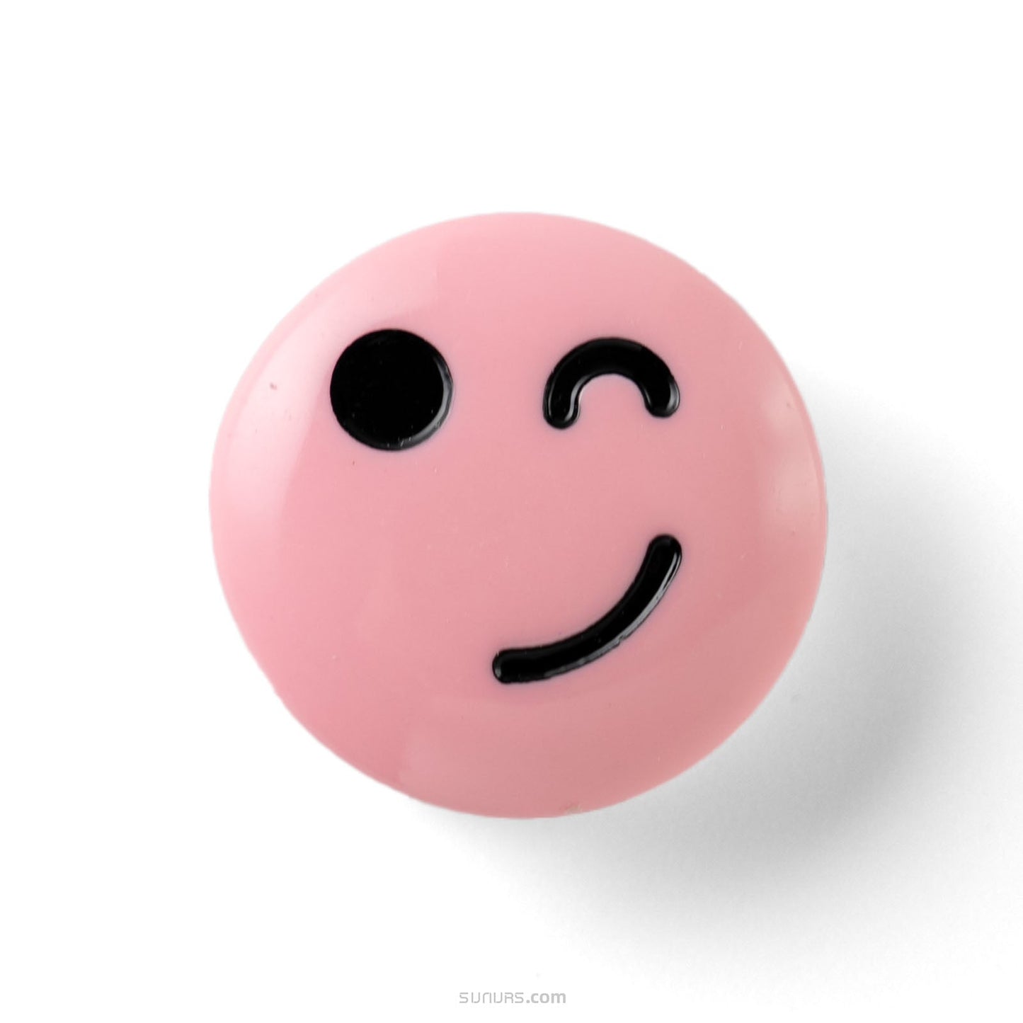 Pink ball with a smiley face design on a white background
